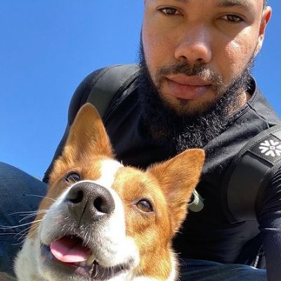 They are taking a selfie while dog is looking somewhere else.